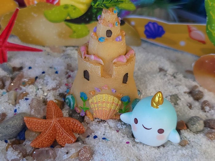 mermaid beach sand castle with blue baby unicorn whale