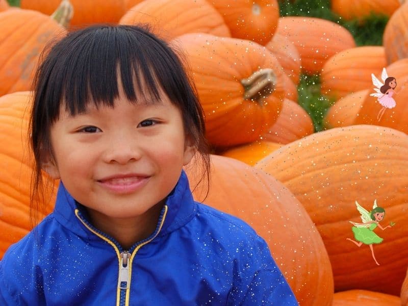 girl in pumpkin patch