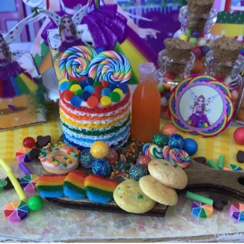 amazing rainbow cake with all the goodies and orange soda